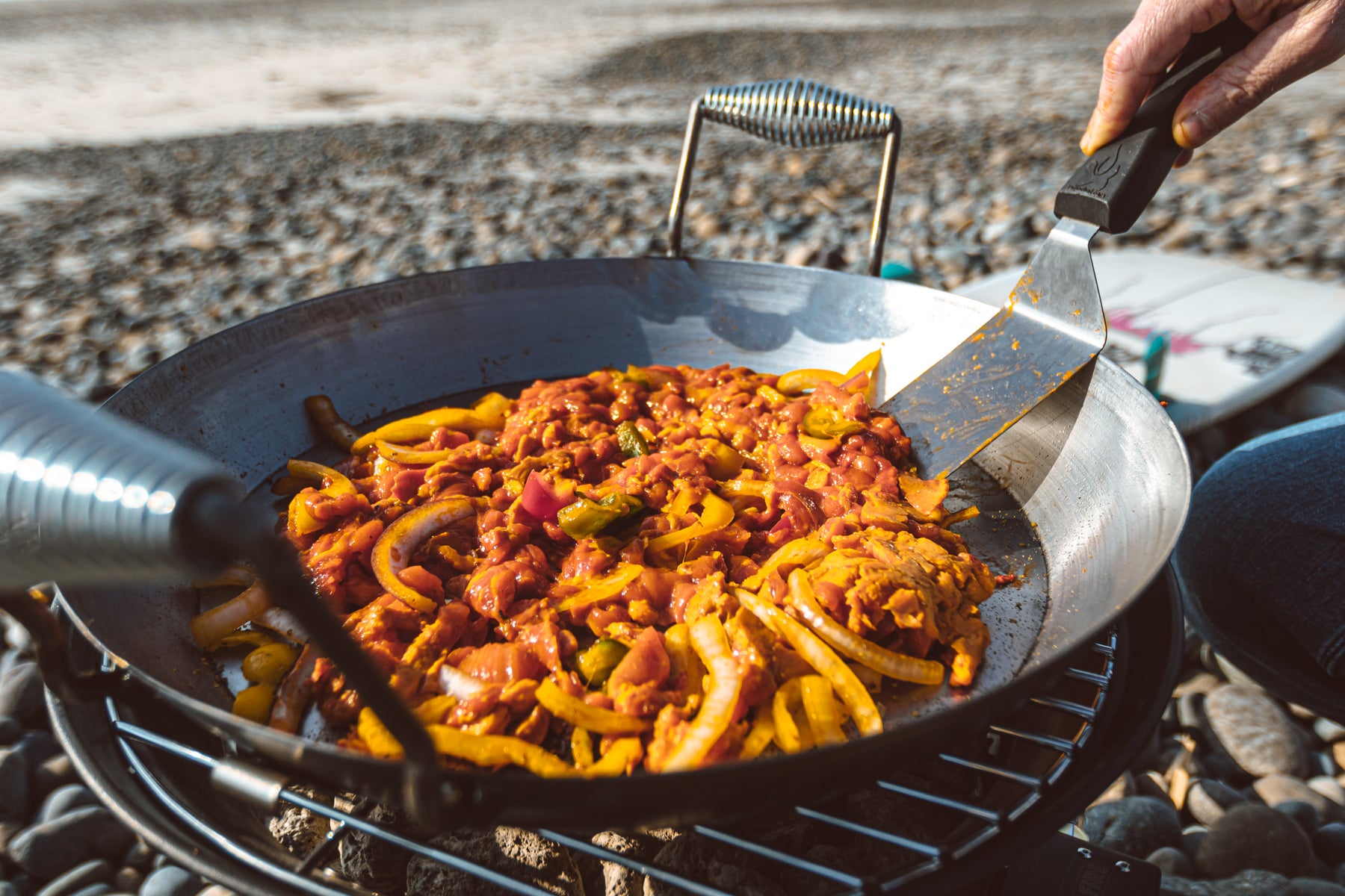 cooking a meal on the best portable grill using the wok mode